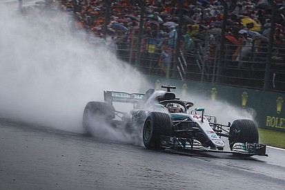 Hungarian GP: Hamilton snatches pole in drenched qualifying