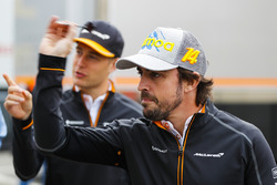 Stoffel Vandoorne, McLaren, and Fernando Alonso, McLaren, play darts