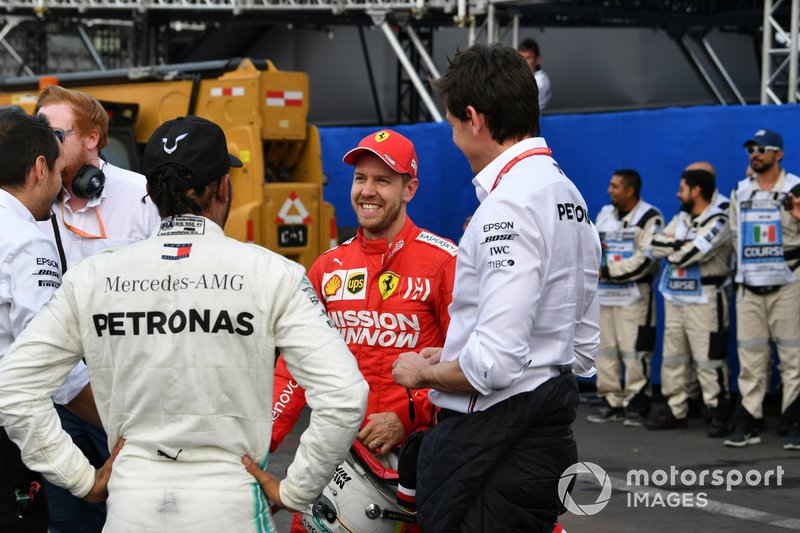 Toto Wolff, Executive Director (Business), Mercedes AMG, with Sebastian Vettel, Ferrari, 2nd position, and Lewis Hamilton, Mercedes AMG F1, 1st position, after the race
