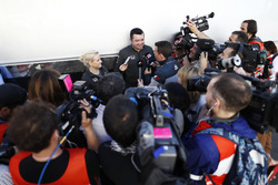 Surrounded by a media scrum, Eric Boullier, Racing Director, McLaren, is interviewed by Will Buxton