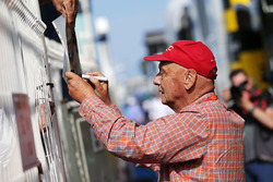 Niki Lauda, Mercedes Non-Executive Chairman signs autographs for the fans