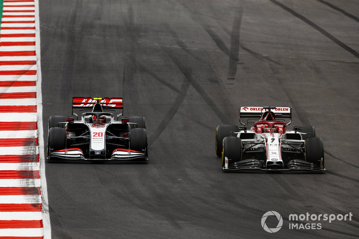 Kimi Raikkonen, Alfa Romeo Racing C39, battles with Kevin Magnussen, Haas VF-20