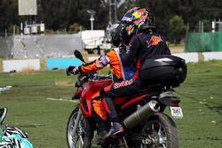 Race retiree Brendon Hartley, Scuderia Toro Rosso gets a ride with a Marshal on a motorbike after re