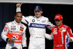 Robert Kubica, BMW Sauber celebrates his first Pole Position with Lewis Hamilton, McLaren and Felipe Massa, Ferrari