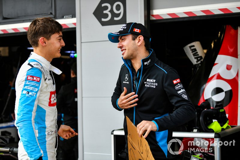 Nicholas Latifi, Williams Racing, holds a message for George Russell, Williams Racing