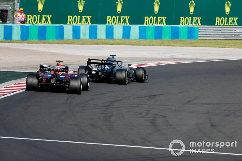 Lewis Hamilton, Mercedes AMG F1 W10 overtakes Max Verstappen, Red Bull Racing RB15 for the lead