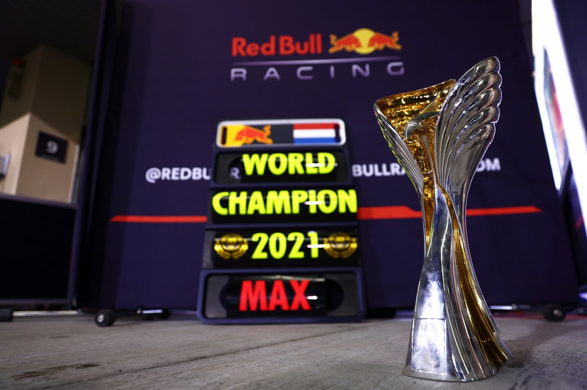 The race winners trophy is pictured in front of a pitboard for 2021 F1 World Drivers Champion Max Verstappen, Red Bull Racing