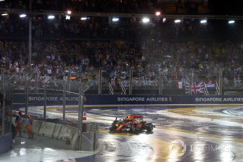 The crashed cars of Kimi Raikkonen, Ferrari SF70H and Max Verstappen, Red Bull Racing RB13 after colliding at the start of the race
