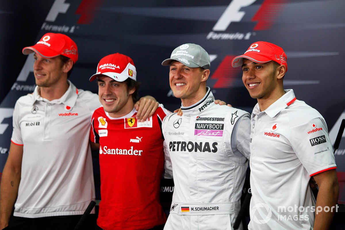 Juara dunia Jenson Button (McLaren), Fernando Alonso (Ferrari), Michael Schumacher (Mercedes), dan Lewis Hamilton (McLaren), berpose sebelum jumpa pers F1 GP Bahrain 2010.