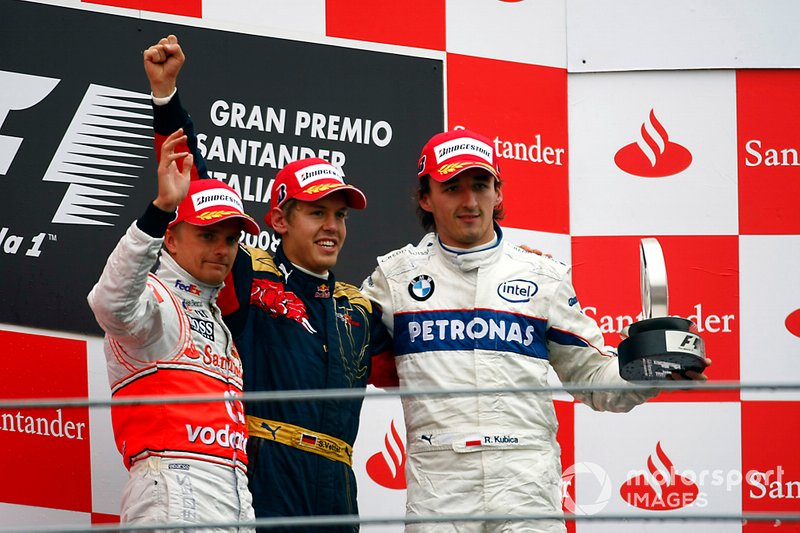Podium: second place Heikki Kovalainen, McLaren, Race winner Sebastian Vettel, Toro Rosso, third place Robert Kubica, BMW Sauber