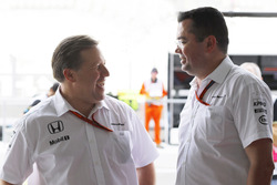 Zak Brown and Eric Boullier, McLaren in the garage.