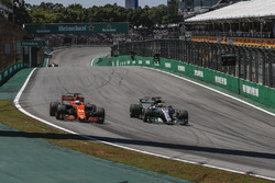 Fernando Alonso, McLaren MCL32 and Lewis Hamilton, Mercedes-Benz F1 W08 battle for position