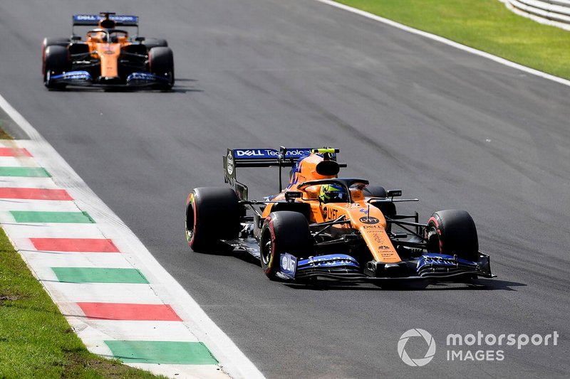 Lando Norris, McLaren MCL34, leads Carlos Sainz Jr., McLaren MCL34