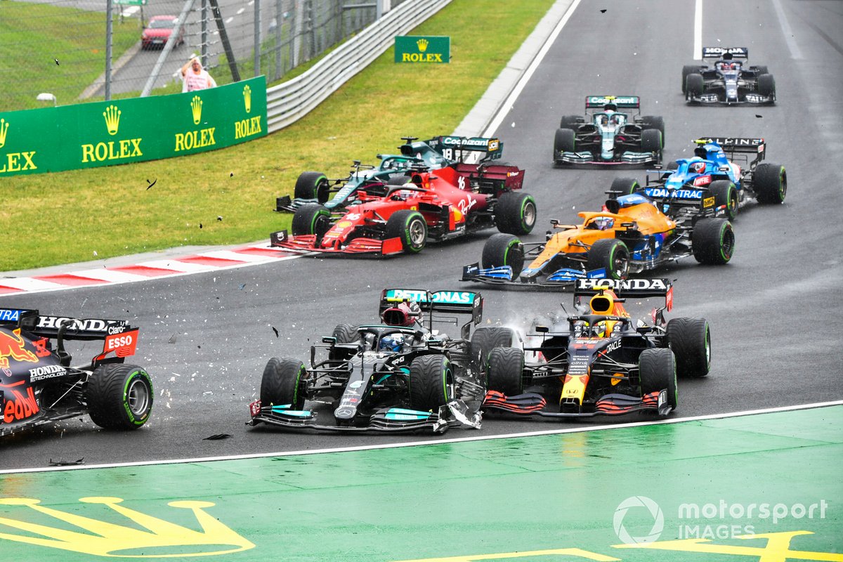 Valtteri Bottas, Mercedes W12, collides with Sergio Perez, Red Bull Racing RB16B, at the start