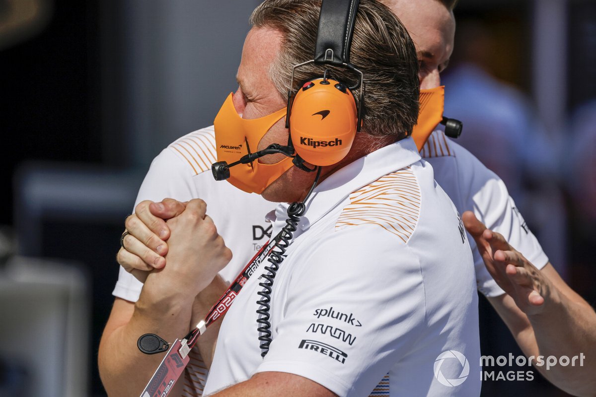 Zak Brown, CEO, McLaren Racing, celebrates with team mates after Qualifying