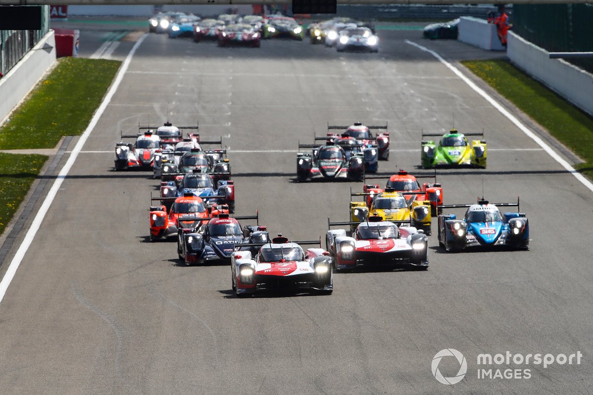 Start of the race, #7 Toyota Gazoo Racing Toyota GR010 - Hybrid: Mike Conway, Kamui Kobayashi, Jose Maria Lopez leads #8 Toyota Gazoo Racing Toyota GR010 - Hybrid: Sebastien Buemi, Kazuki Nakajima, Brendon Hartley