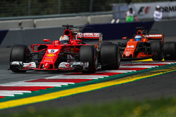 Sebastian Vettel, Ferrari SF70H and Fernando Alonso, McLaren MCL32