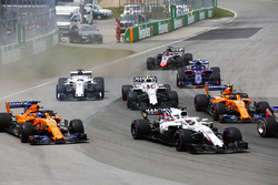 Lance Stroll, Williams FW41, leads Fernando Alonso, McLaren MCL33, Stoffel Vandoorne, McLaren MCL33,