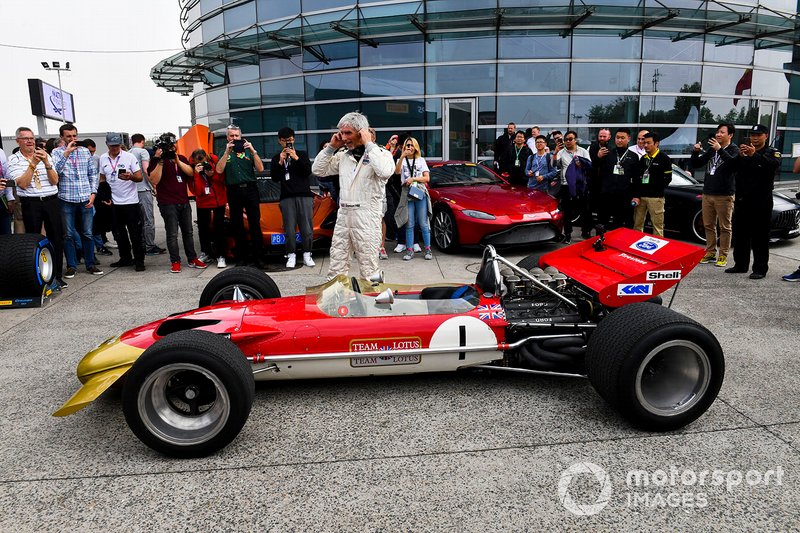 Damon Hill with the Lotus 49 driven by his father Graham Hill to win the 1968 world drivers championship