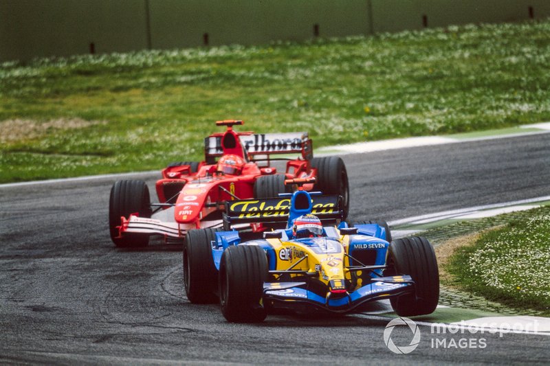 Fernando Alonso, Renault R25, leads Michael Schumacher, Ferrari F2005