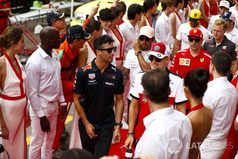 Daniel Ricciardo, Red Bull Racing, Marcus Ericsson, Sauber, Lewis Hamilton, Mercedes AMG F1, Kimi Raikkonen, Ferrari and Kevin Magnussen, Haas F1 Team, walk between Tag Heuer promotional models
