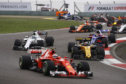 Kimi Raikkonen, Ferrari SF70H, leads Nico Hulkenberg, Renault Sport F1 Team RS17, Felipe Massa, Will