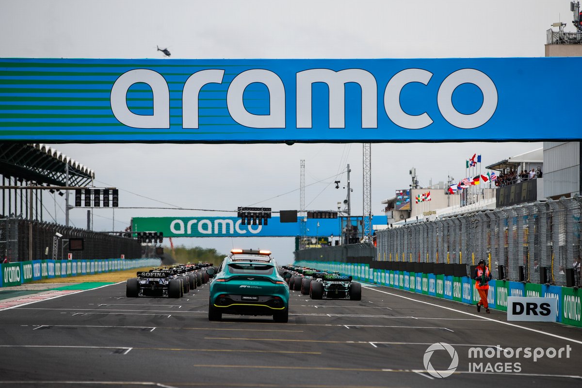 The Medical Car sits at the rear as the cars line up on the grid for the start of the race