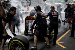 The brakes of Max Verstappen, Red Bull Racing RB12, catch fire in the pits