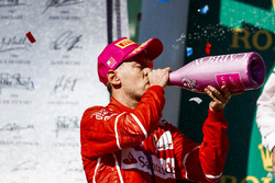 Second place Sebastian Vettel, Ferrari, drinks Champagne on the podium
