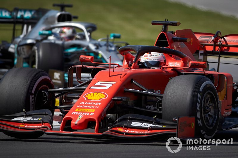 Sebastian Vettel, Ferrari SF90, leads Lewis Hamilton, Mercedes AMG F1 W10