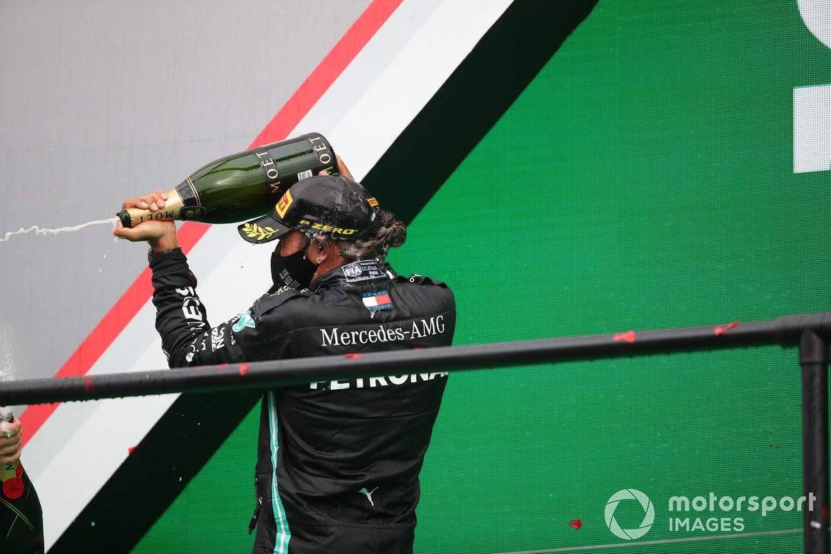 Lewis Hamilton, Mercedes-AMG F1, 1st position, celebrates on the podium with Champagne