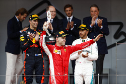 Sebastian Vettel, Ferrari, raises his second place trophy