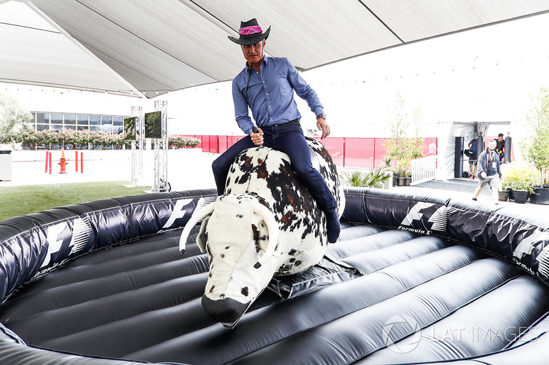 David Coulthard, Commentator, Channel 4 F1, tries his hand on a mechanical rodeo bull