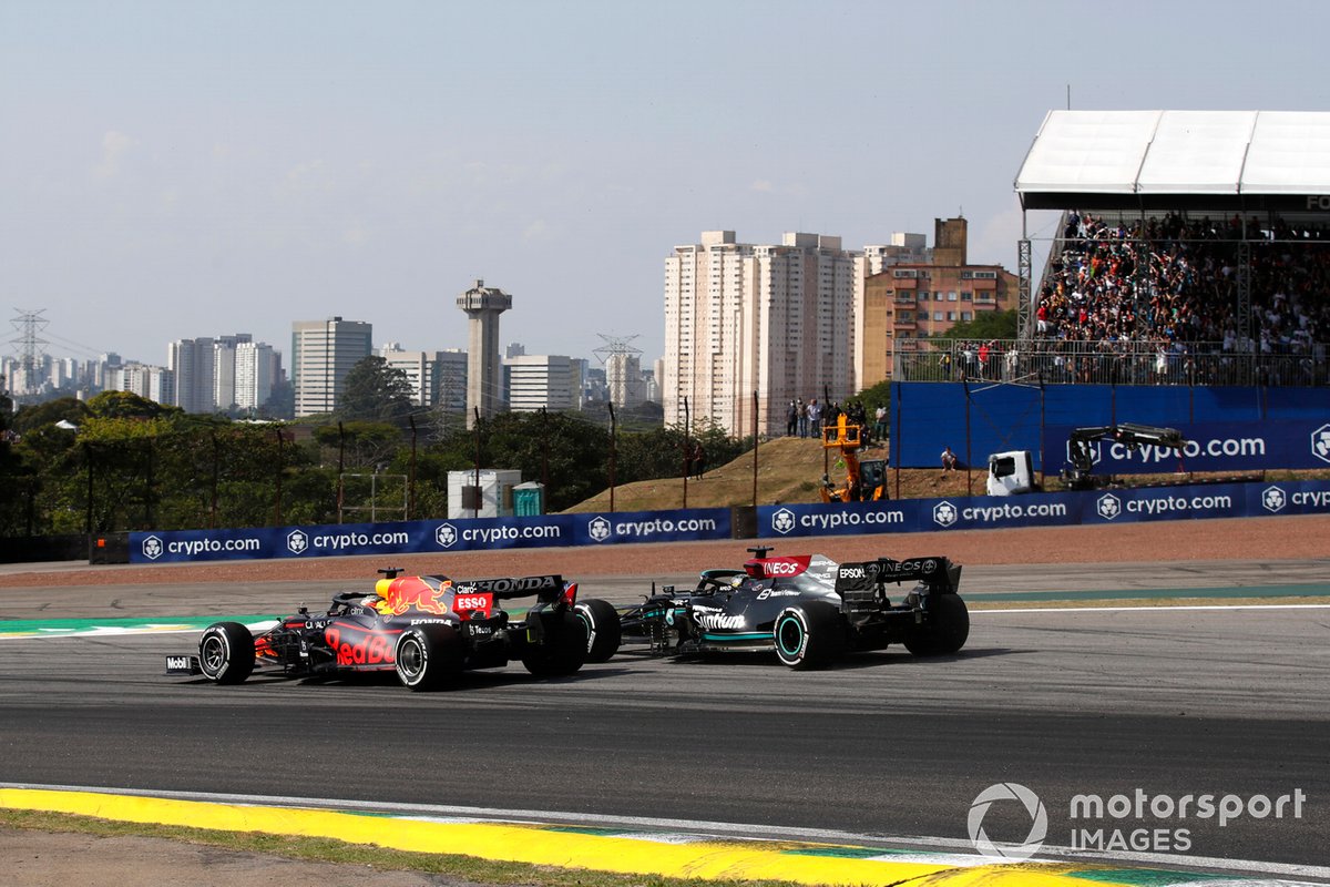 Max Verstappen, Red Bull Racing RB16B, battles with Lewis Hamilton, Mercedes W12