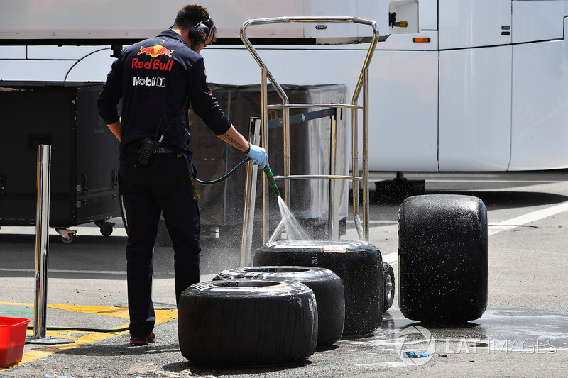 Red Bull Racing mechanic washes Pirelli tyres