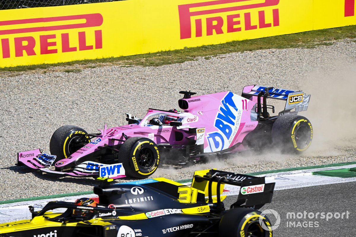 Sergio Perez, Racing Point RP20, in the gravel as Esteban Ocon, Renault F1 Team R.S.20, passes