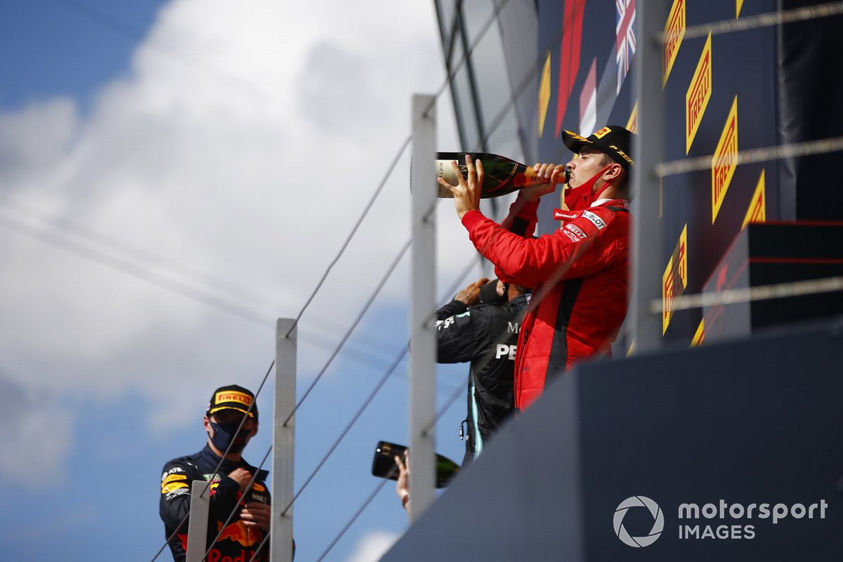 Max Verstappen, Red Bull Racing, 2nd position, Lewis Hamilton, Mercedes-AMG F1, 1st position, and Charles Leclerc, Ferrari, 3rd position, celebrate with Champagne on the podium