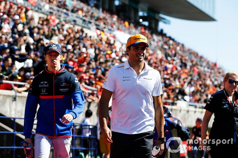 Carlos Sainz Jr., McLaren, and Daniil Kvyat, Toro Rosso, in the drivers parade
