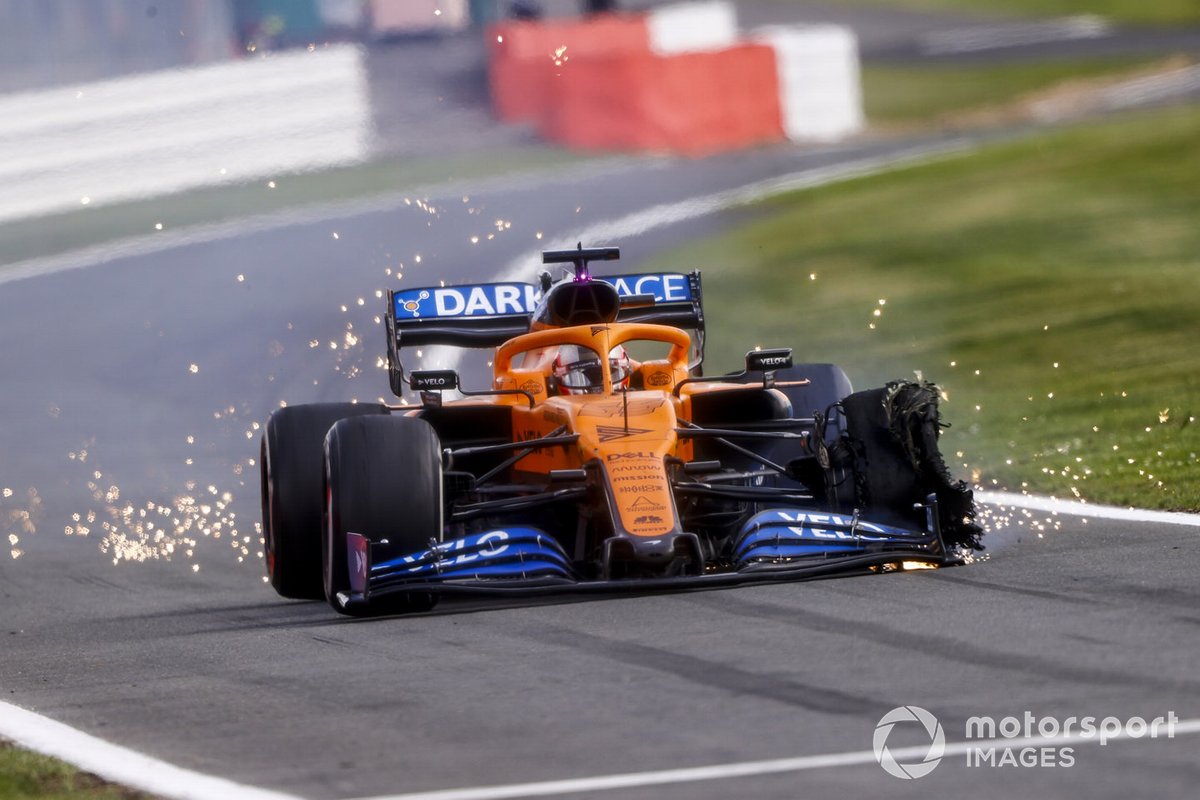 Carlos Sainz Jr., McLaren MCL35, heads into the pits with a front puncture