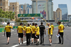 Kevin Magnussen, Renault Sport F1 Team and Esteban Ocon, Renault Sport F1 Team Test Driver walk the