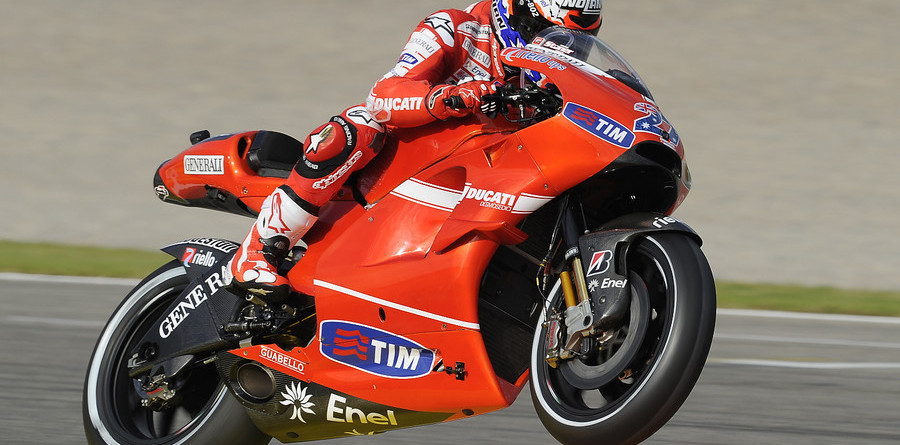 Stoner storms to emotional pole in Valencia Stoner storms to emotional pole in Valencia