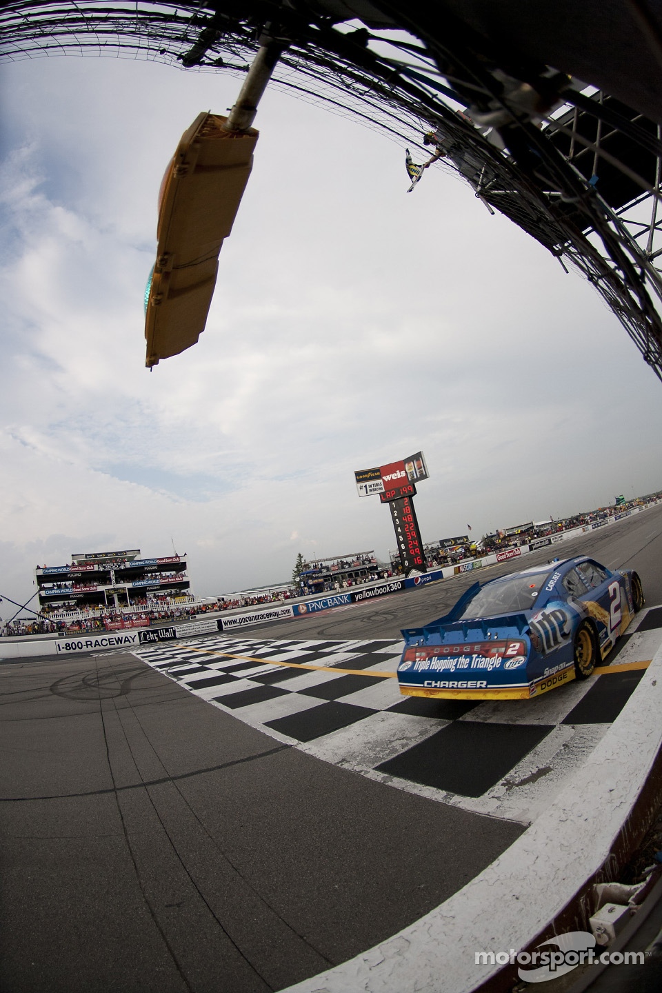 Brad Keselowski, Penske Racing Dodge takes the checkered flag
