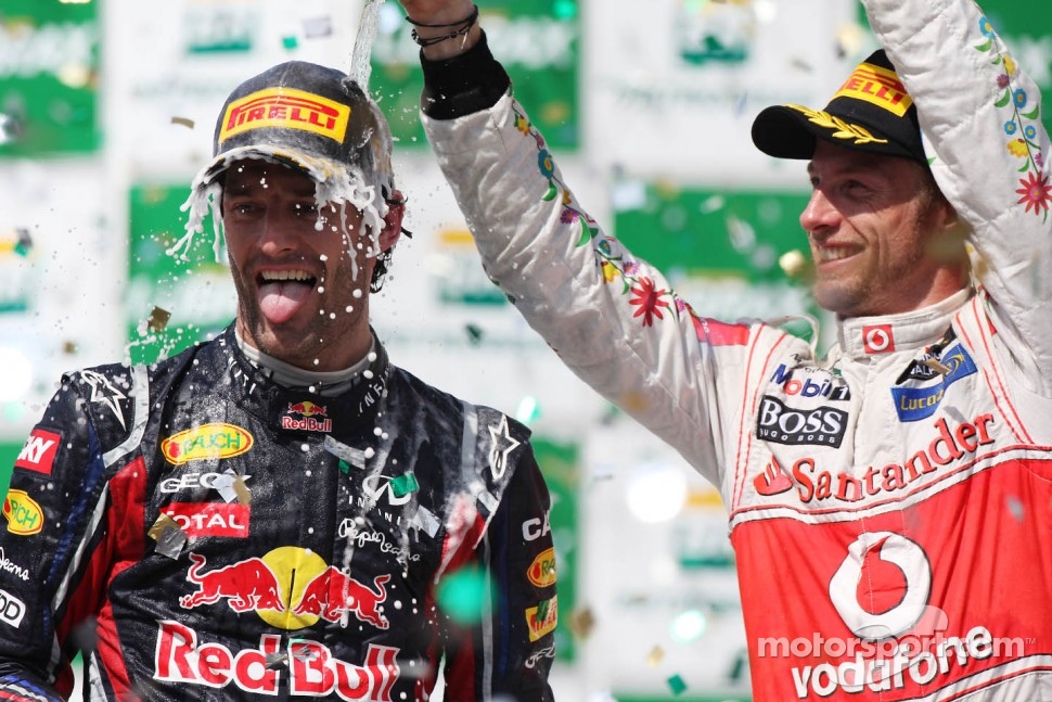 Podium: race winner Mark Webber, Red Bull Racing and third place Jenson Button, McLaren Mercedes