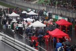 Cars on the grid as the race is stopped during a thunderstorm