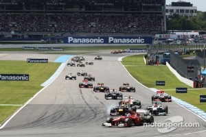 Fernando Alonso, Ferrari leads at the start of the race as Sebastian Vettel, Red Bull Racing and Michael Schumacher, Mercedes AMG F1 battle for second position