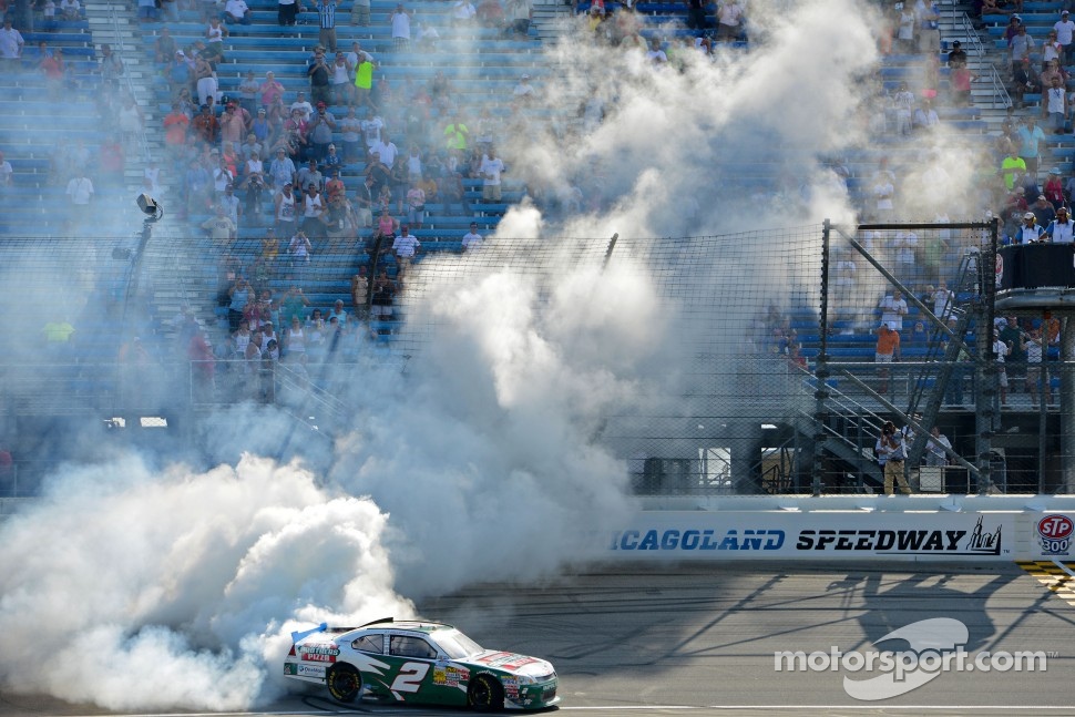 Race winner Elliott Sadler celebrates
