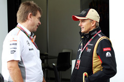 (L to R): Dr. Aki Hintsa, McLaren Team Doctor with Heikki Kovalainen, Lotus F1 Team