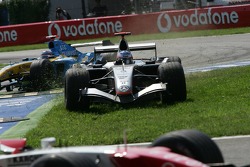 Kimi Raikkonen cuts in the grass