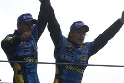 Podium: Giancarlo Fisichella and Fernando Alonso celebrate