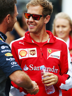 Sebastian Vettel, Ferrari con Christian Horner, Team Principal Red Bull Racing